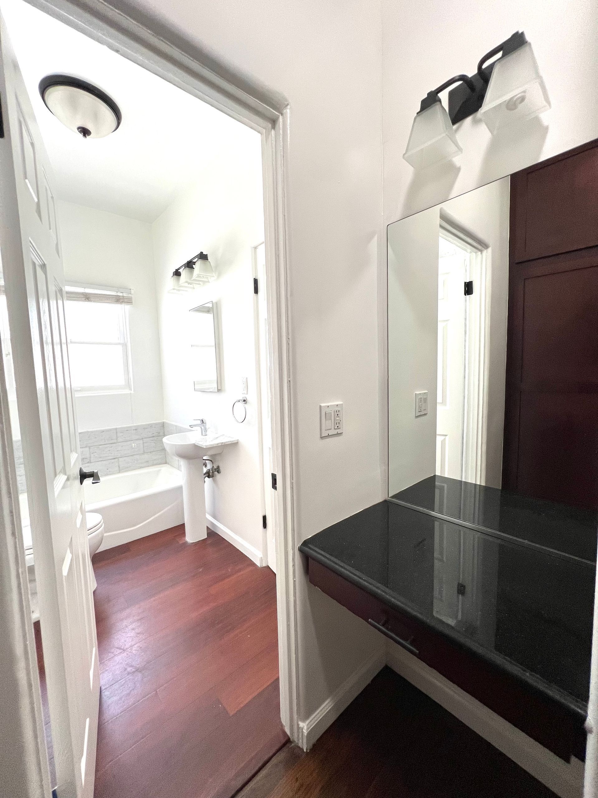 A bathroom with a sink and a mirror