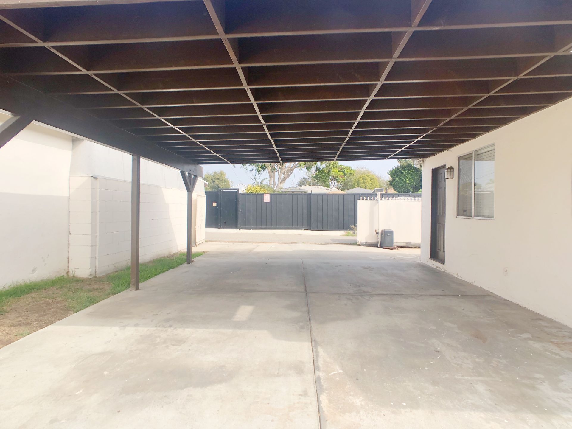 An empty parking lot with a wooden roof