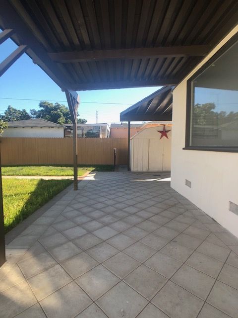 A house with a covered patio and a star on it