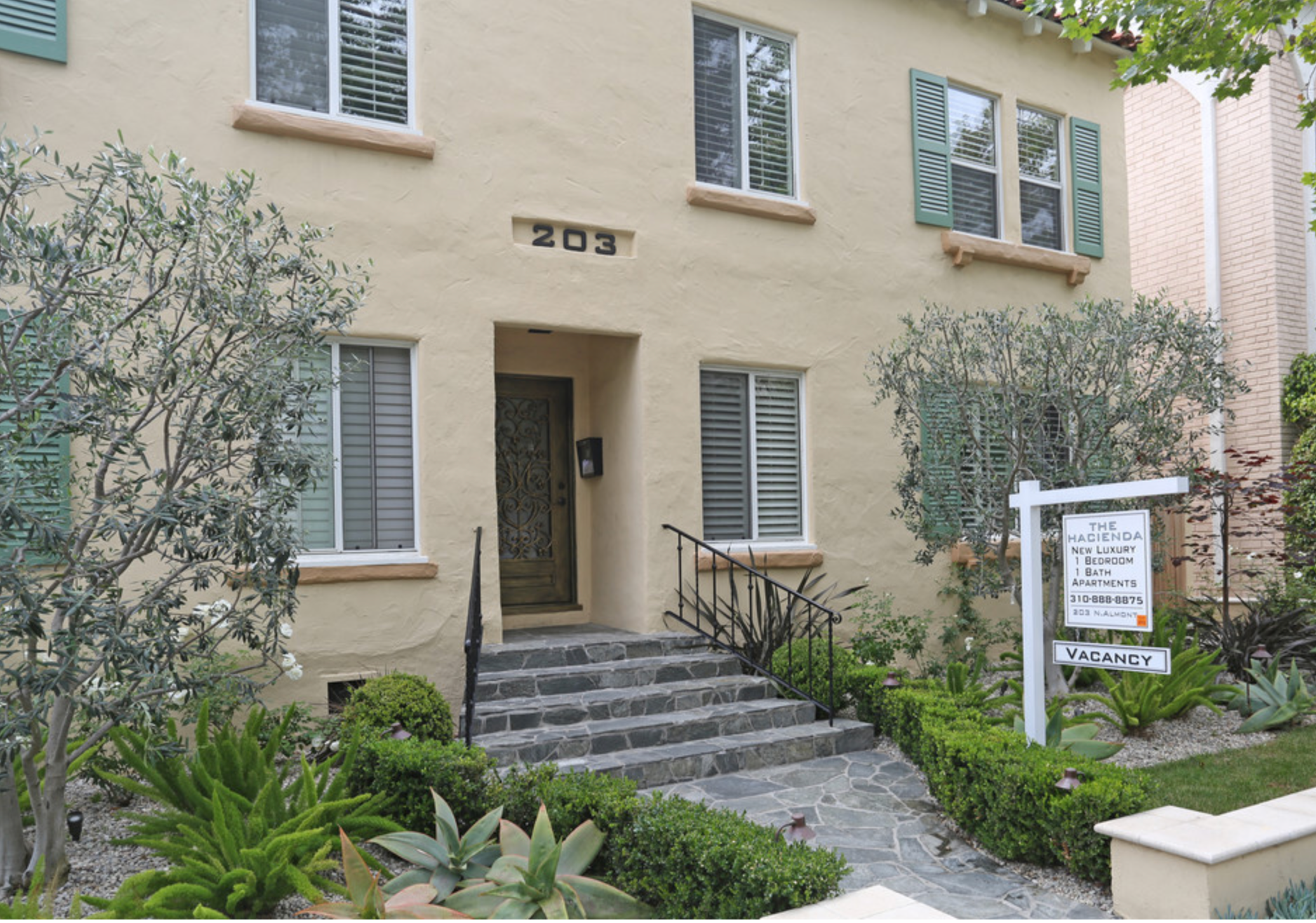 A house with the number 203 on the front of it