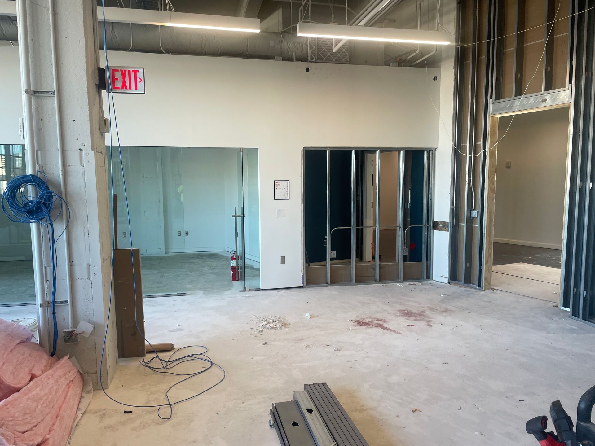 A wall with a bunch of electrical boxes and meters on it