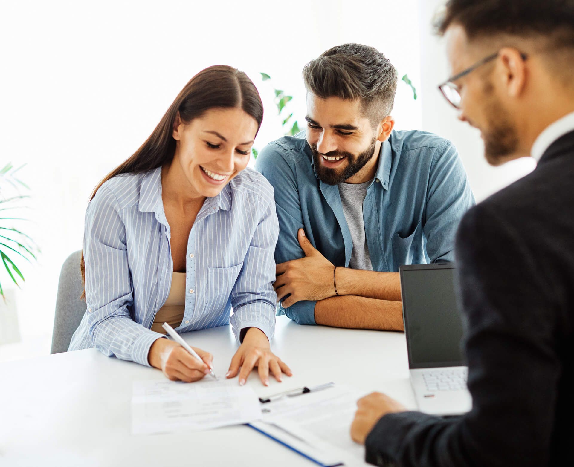 Couple Signing a Document