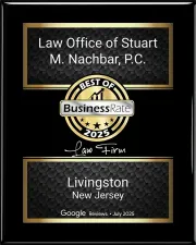 A black and gold award plaque for the Law Office of Stuart M. Nachbar, P.C., named a 2025 Best Business in Livingston, NJ.