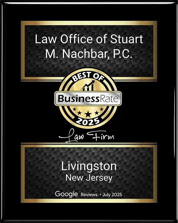 A black and gold award plaque for the Law Office of Stuart M. Nachbar, P.C., named a 2025 Best Business in Livingston, NJ.