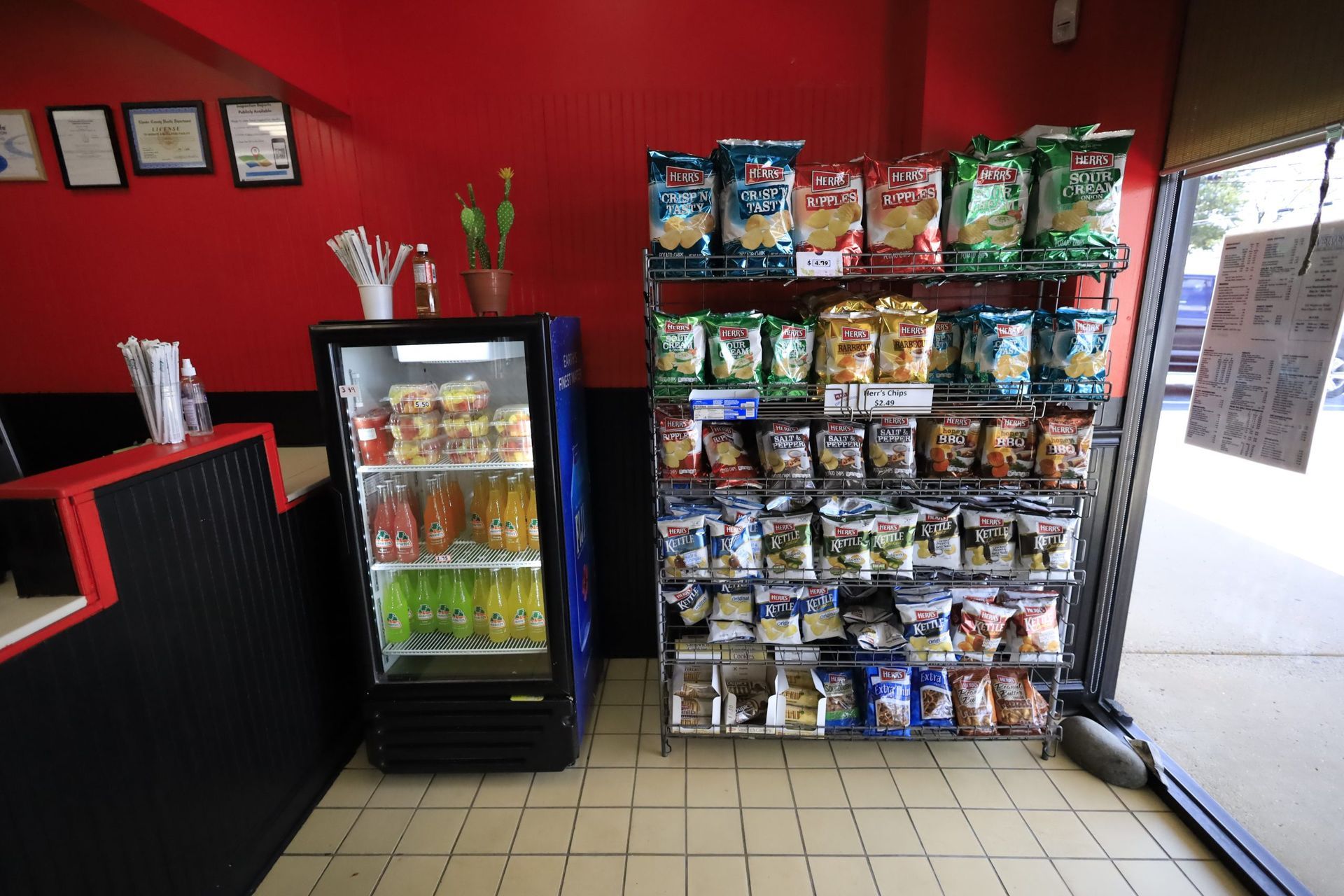 So Sabroso Restaurant With a Fridge and a Shelf Full of Snacks
