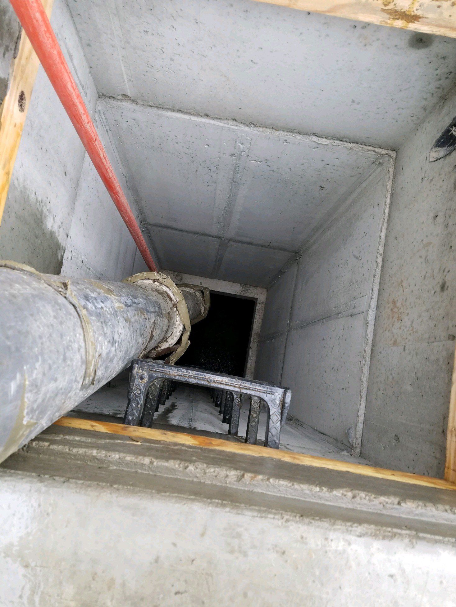 sludge hauling — worker closing manhole in Cleveland, OH