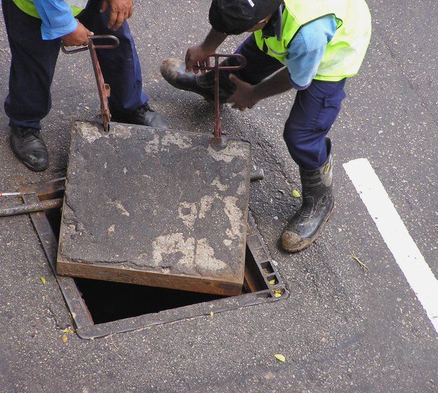 sewer — open residential manhole in Cleveland, OH