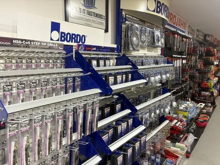 Shelves stocked with BORDO brand accessories in a retail store. Items are packaged and displayed for sale.