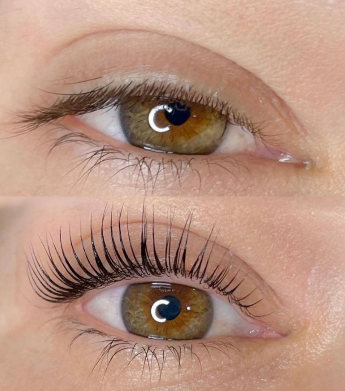 A close up of a woman applying mascara to her eyelashes.