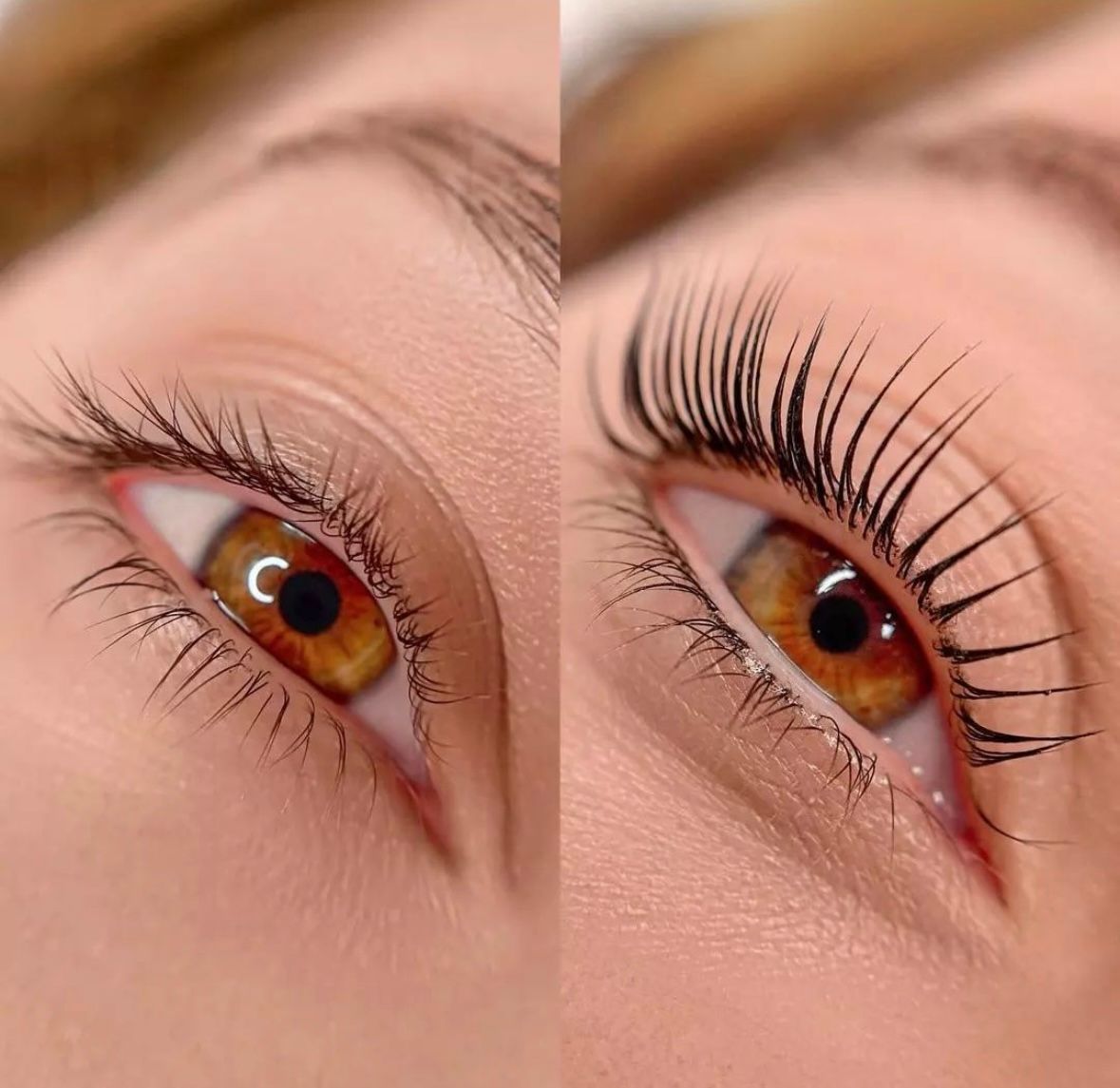 A close up of a woman 's green eye with long eyelashes.