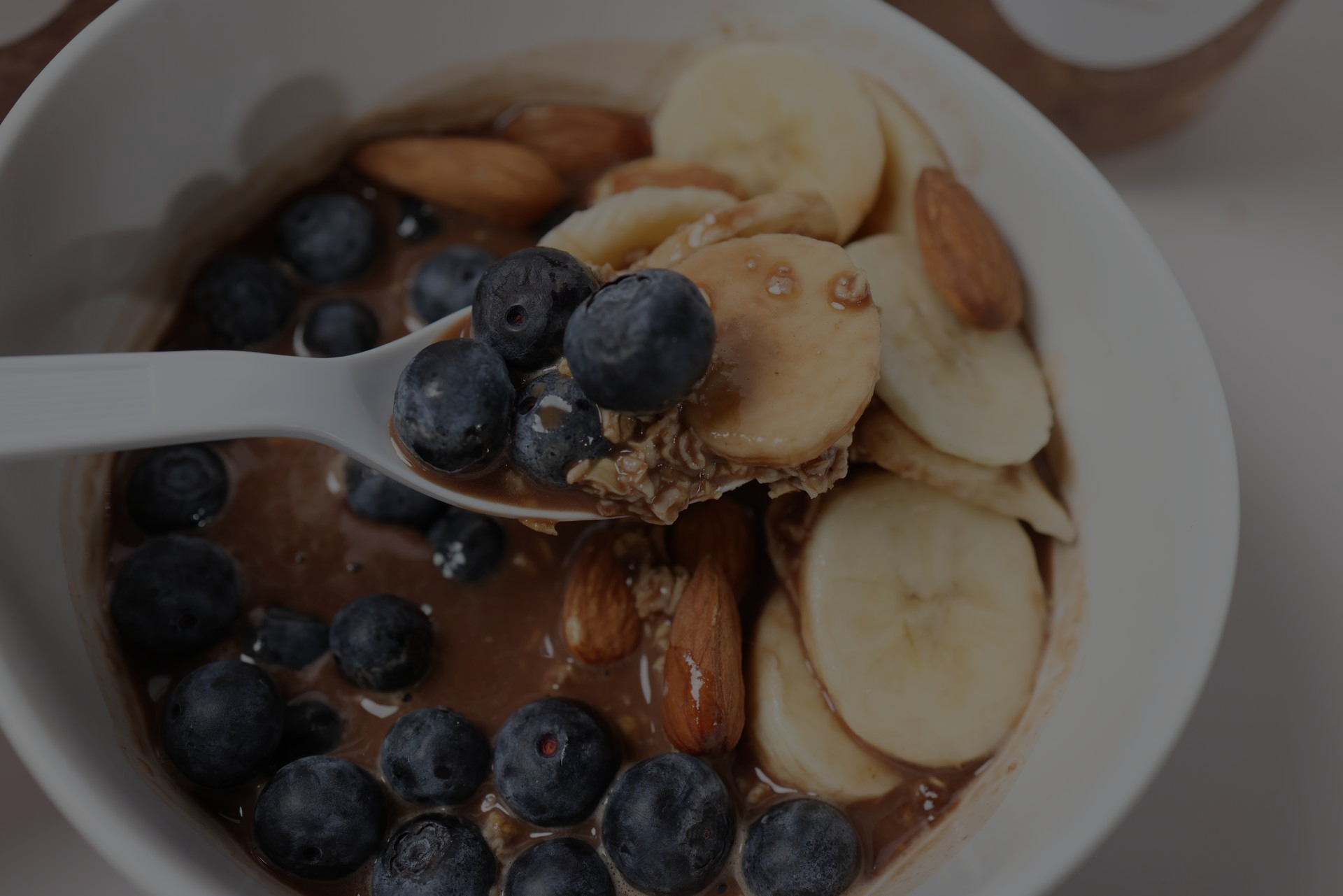 A person is cutting vegetables on a cutting board.
