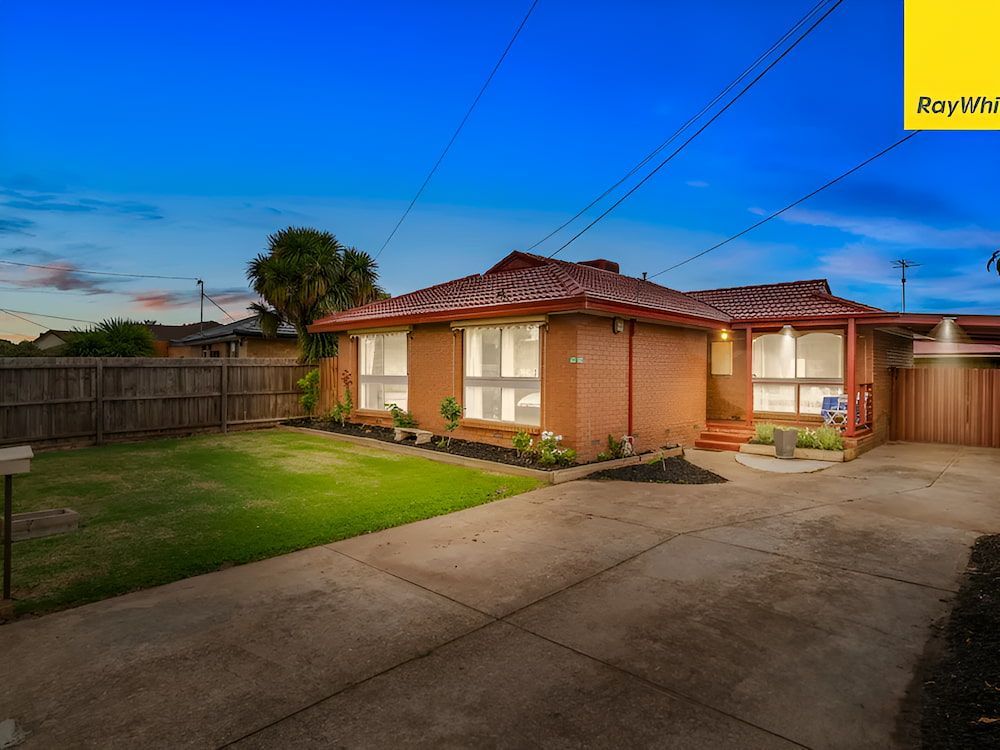 A House With A Lot Of Windows And A Fence In Front Of It — Romy Sidhu Ray White Weir Views In Melton, VIC
