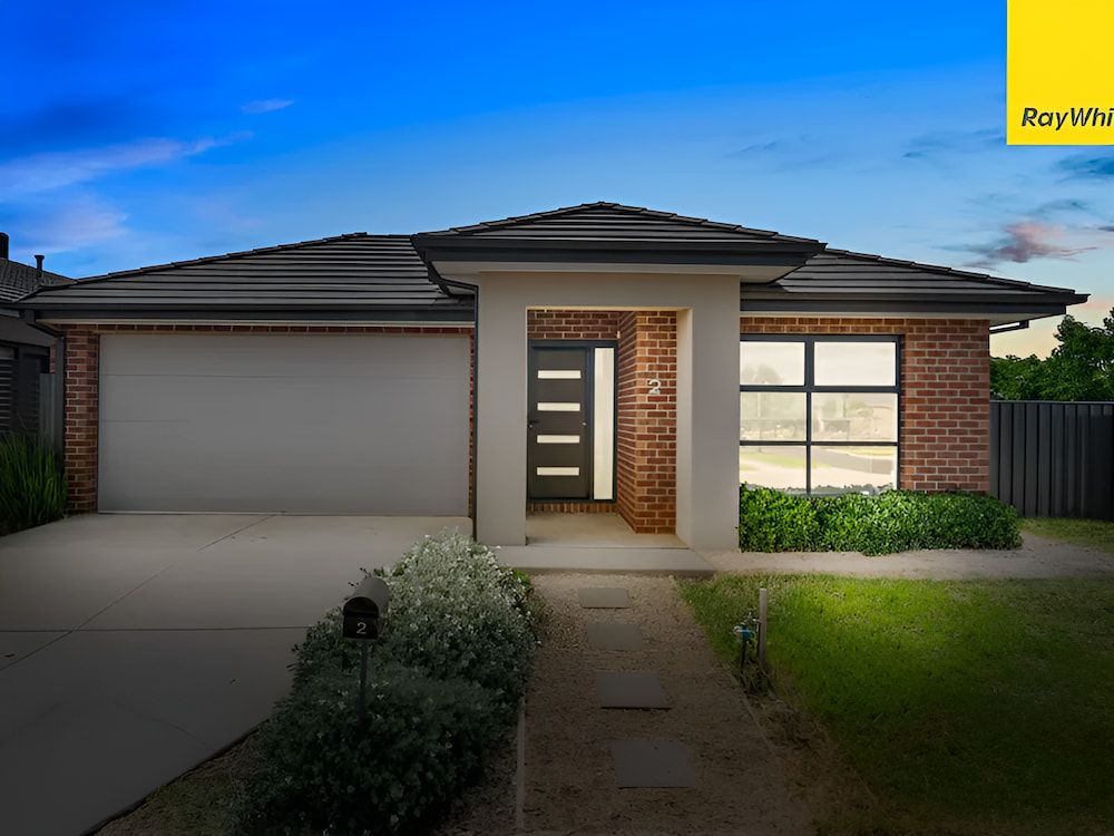 A Modern Brick House With A Garage And A Driveway — Romy Sidhu Ray White Weir Views In Melton, VIC