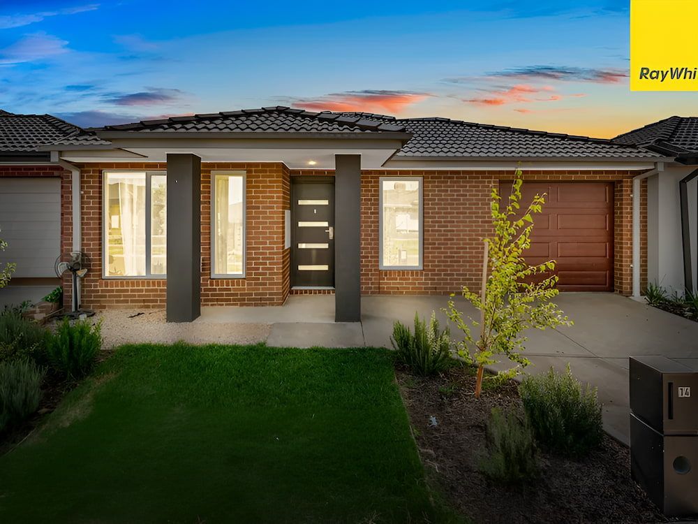 The Front Of A Brick House With A Lawn In Front Of It — Romy Sidhu Ray White Weir Views In Melton, VIC