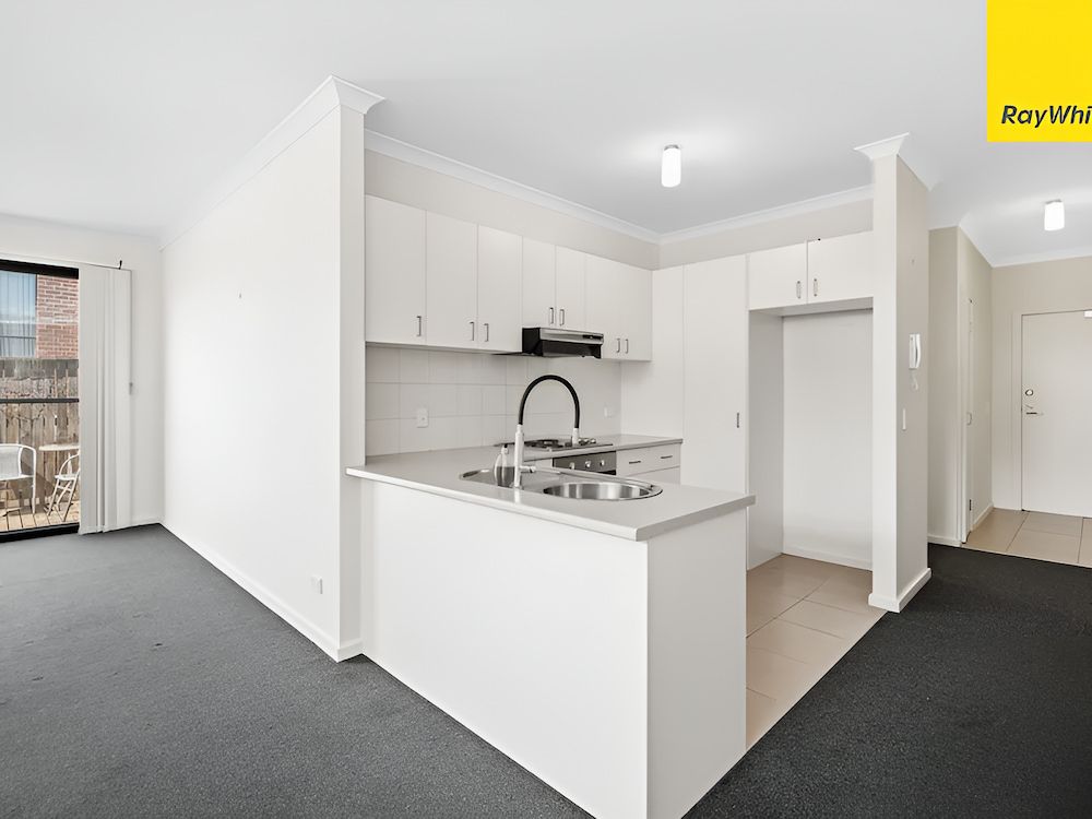 A Kitchen With White Cabinets And Stainless Steel Appliances — Romy Sidhu Ray White Weir Views In Weir Views, VIC