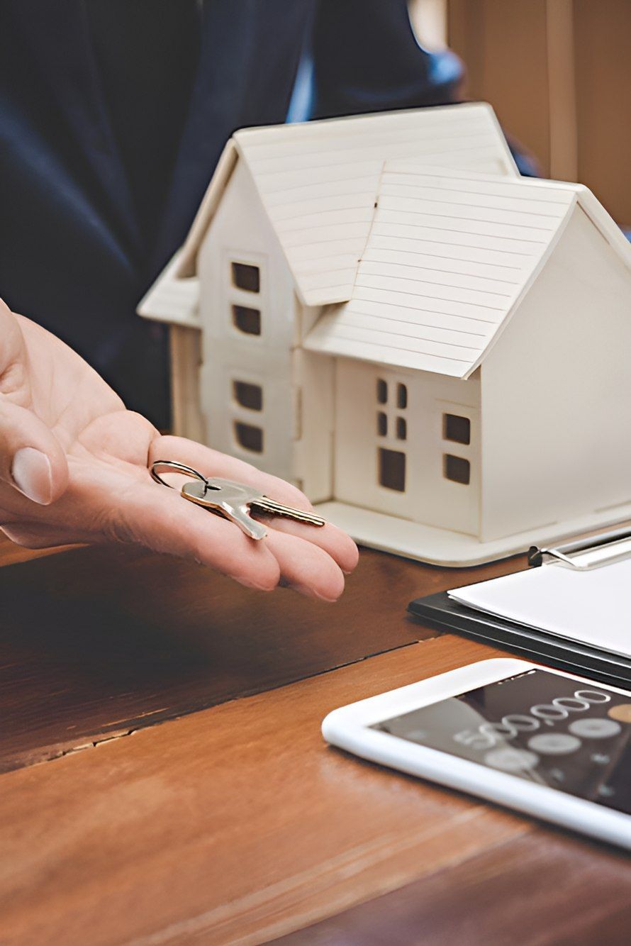 A Person Is Holding A Pair Of Keys In Front Of A Model House — Romy Sidhu Ray White Weir Views In Weir Views, VIC
