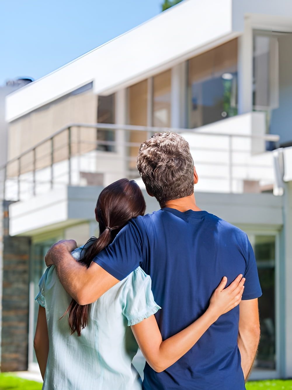A Man And A Woman Are Standing In Front Of A House  — Romy Sidhu Ray White Weir Views In Melton, VIC