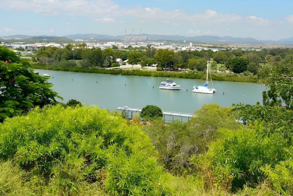 A River With Boats In It And A City In The Background — Romy Sidhu Ray White Weir Views In Melton, VIC