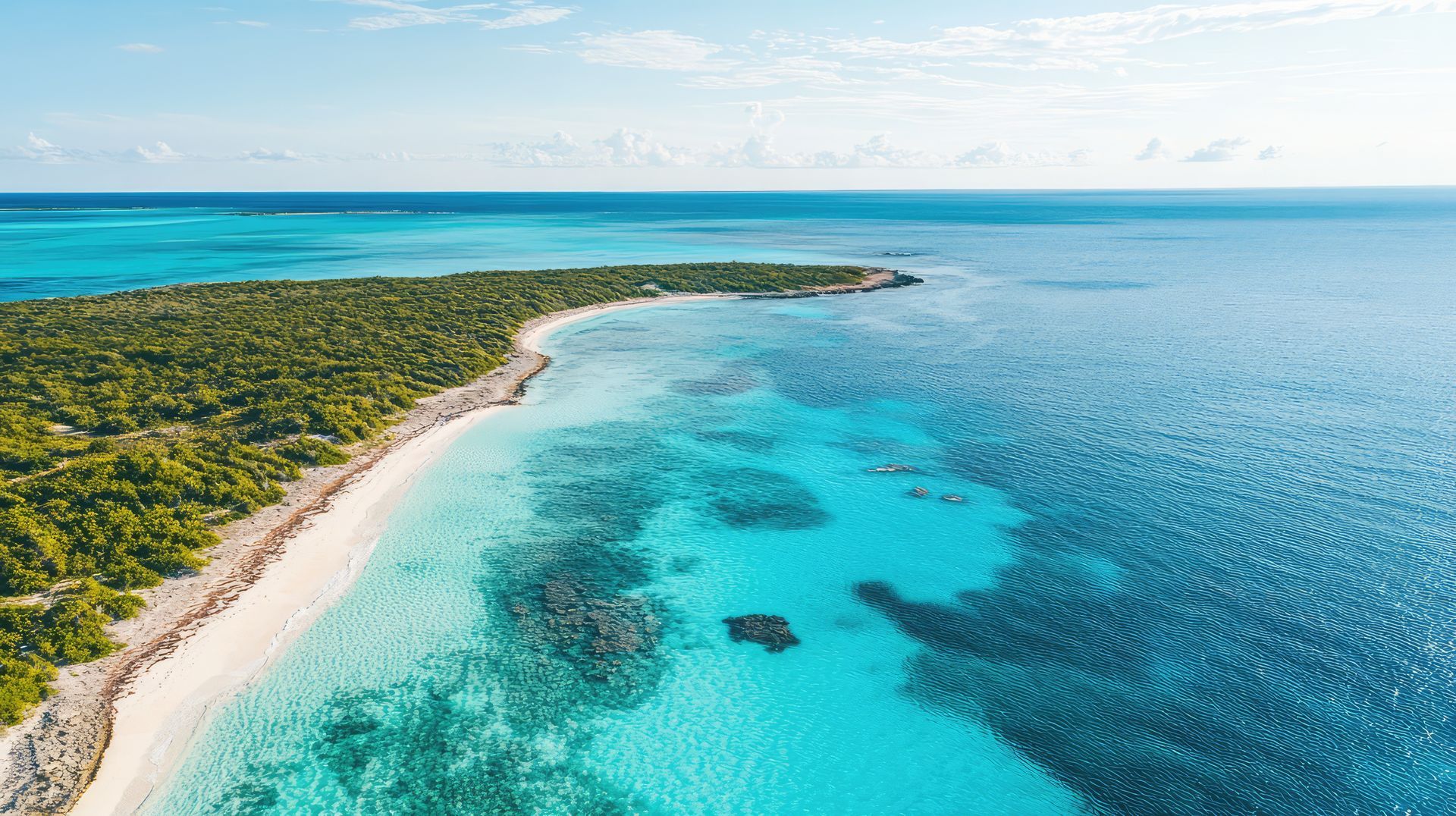 An aerial view of a small island in the middle of the ocean.
