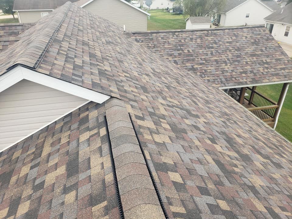 An aerial view of a roof with shingles on it.