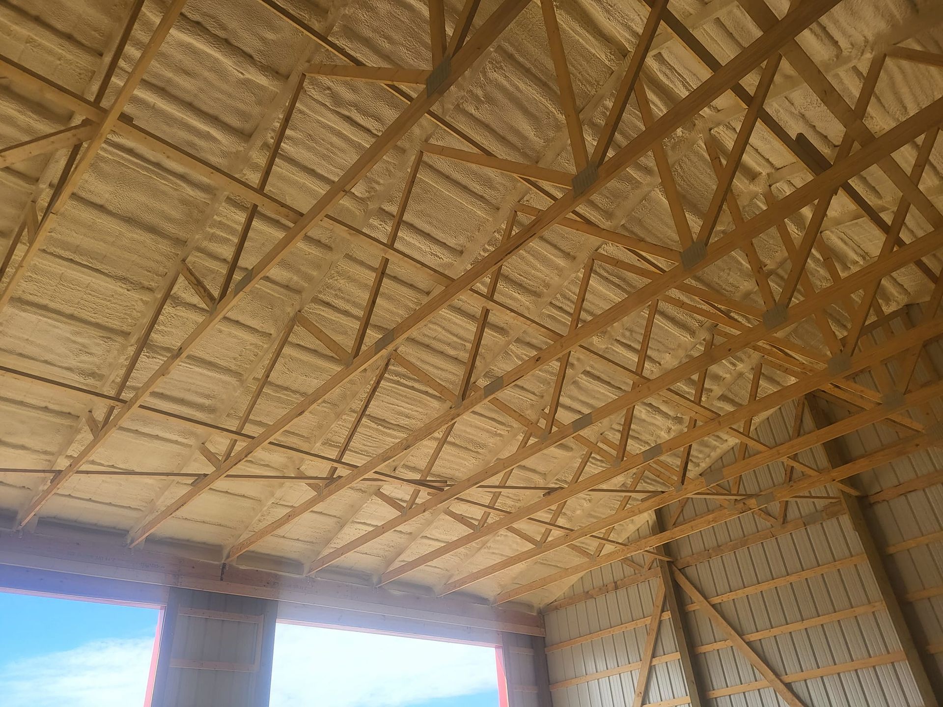 The ceiling of a building with a lot of wood and foam on it.