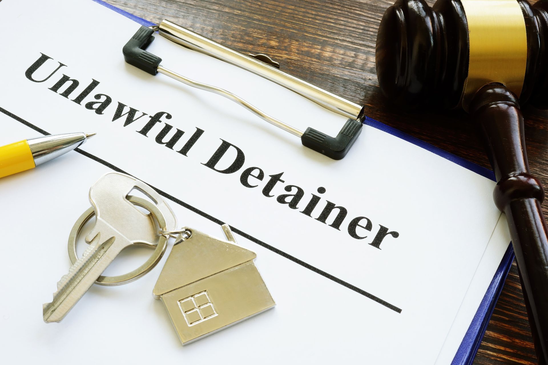 Unlawful detainer papers, key and gavel
