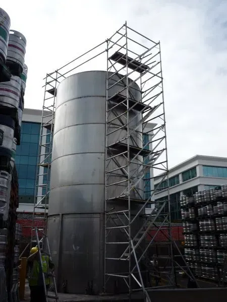 A large metal structure with scaffolding around it
