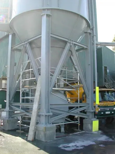 A large metal structure with stairs leading up to it