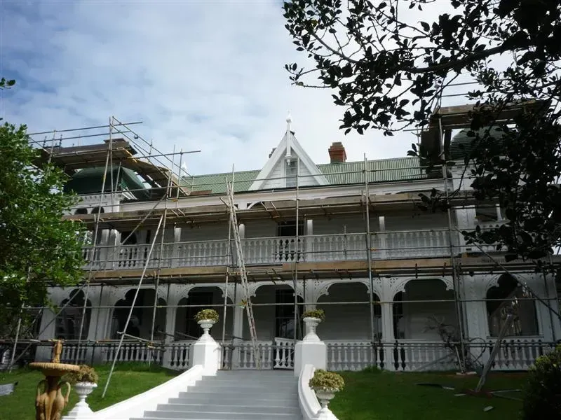 A large white house with scaffolding around it
