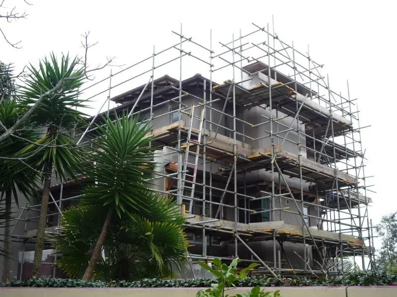A large building is being built with scaffolding around it