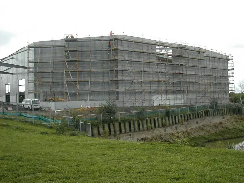 A large building is being built with scaffolding around it.