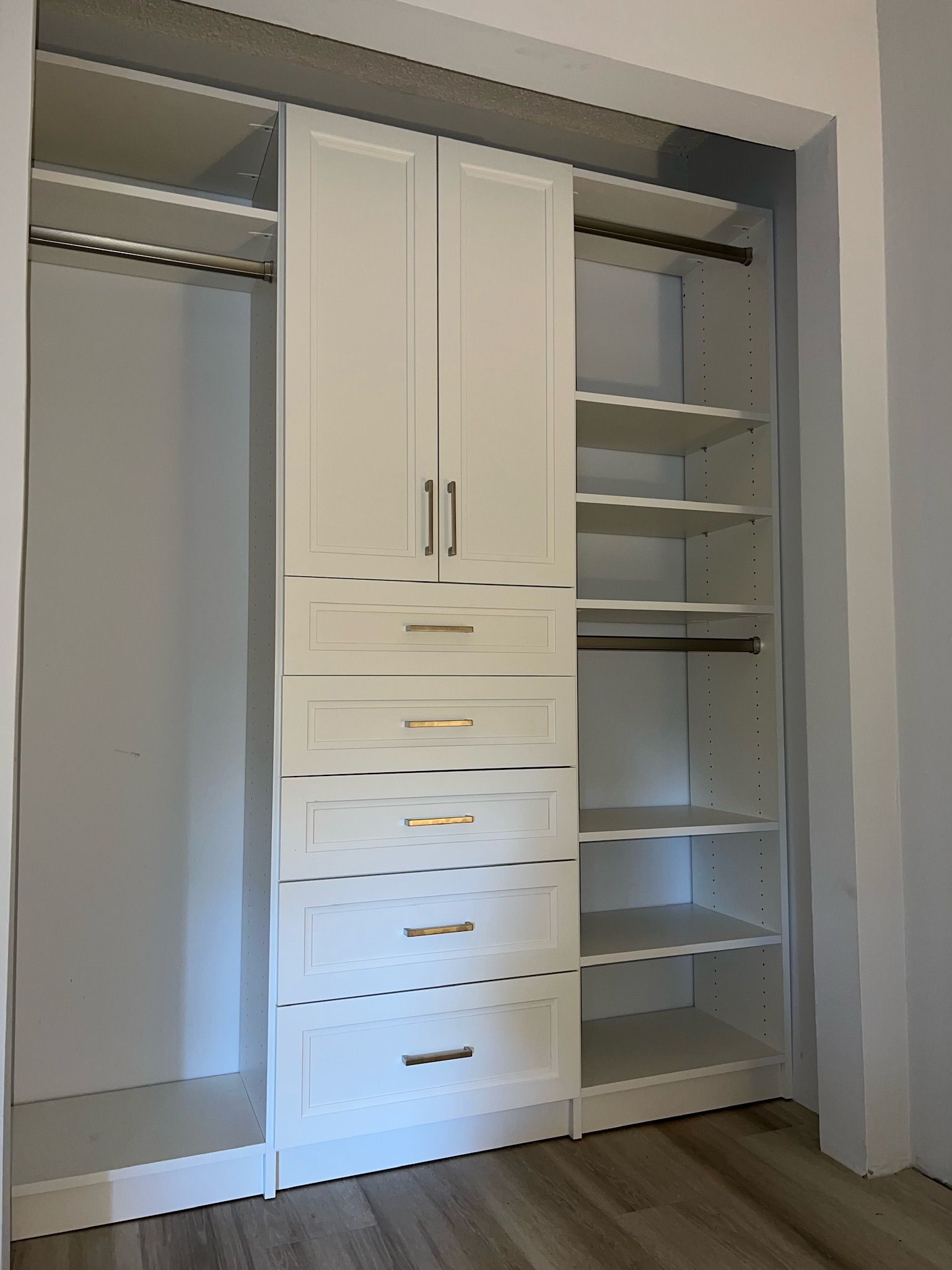 A closet with a lot of drawers and shelves