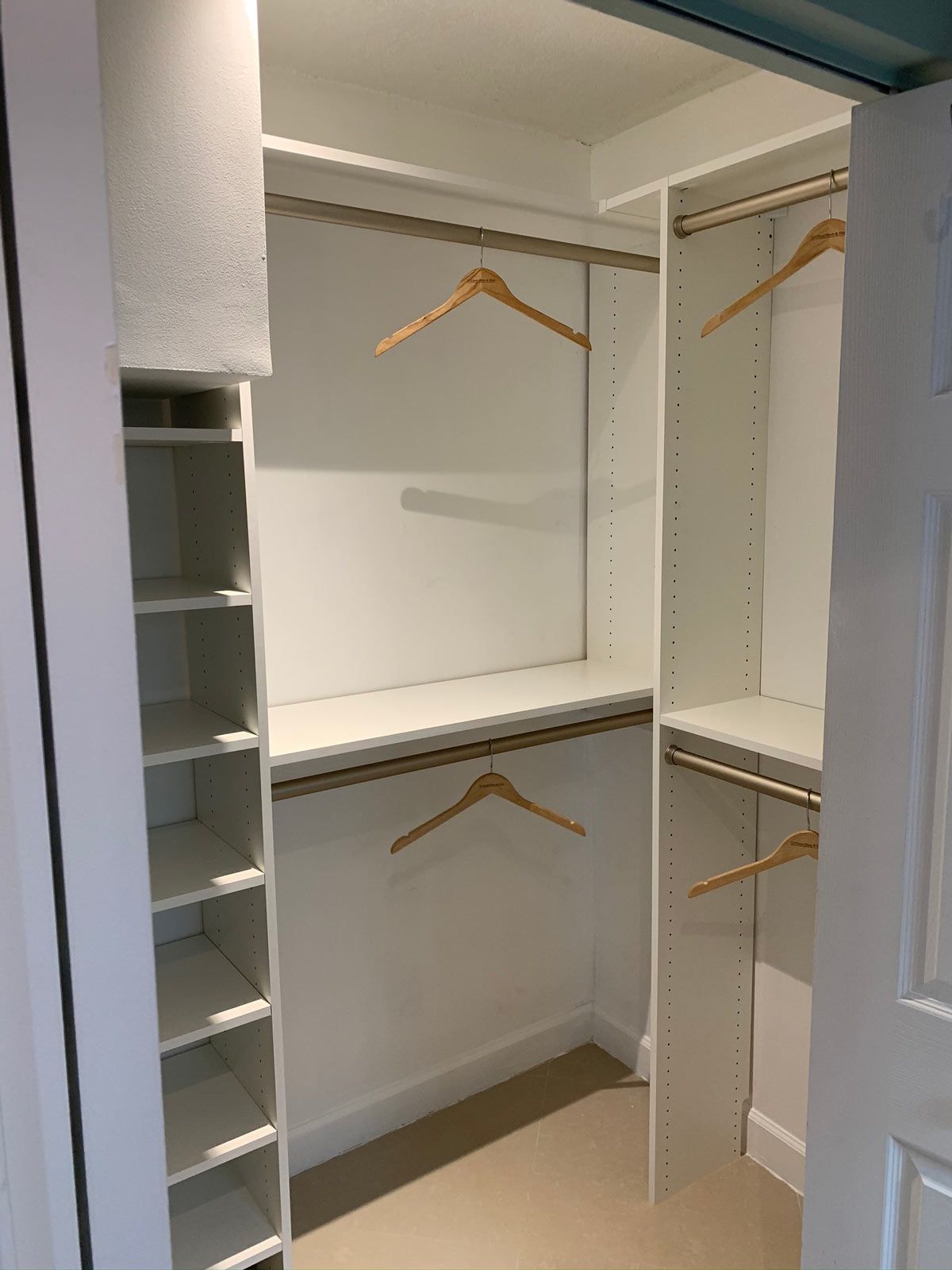 Custom Closet System with Shaker Draw Fronts and Bronze Hardware