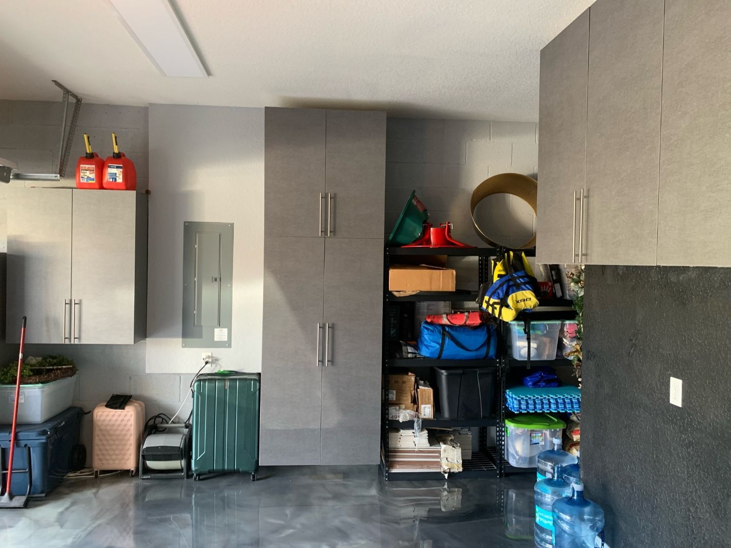 Pewter Garage Cabinets With Slatwall Organizer System and Epoxy Flooring