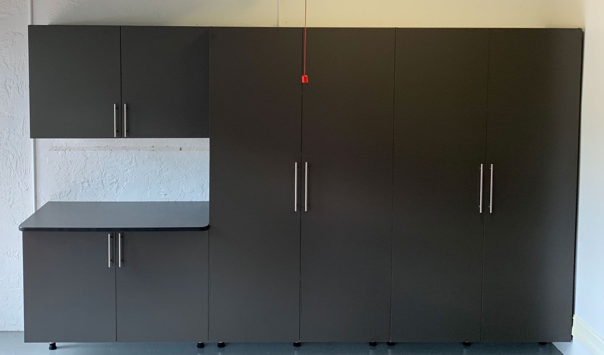 A kitchen with a lot of cabinets and a counter top.