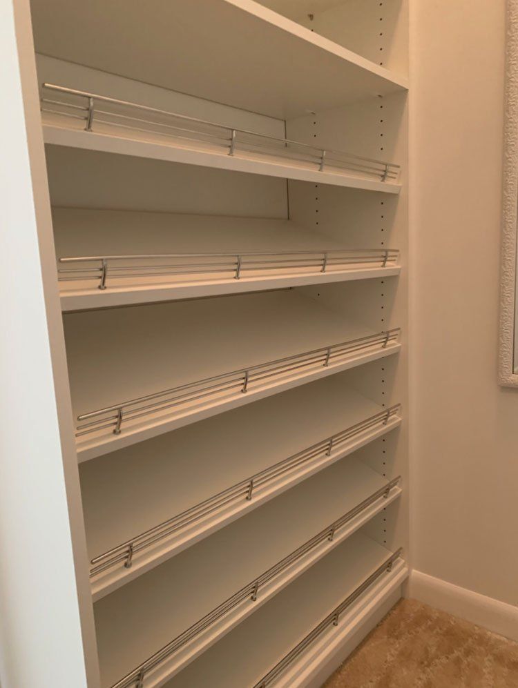 White Custom Closet - Modern Drawer Fronts With Half Angled Shoe Tower