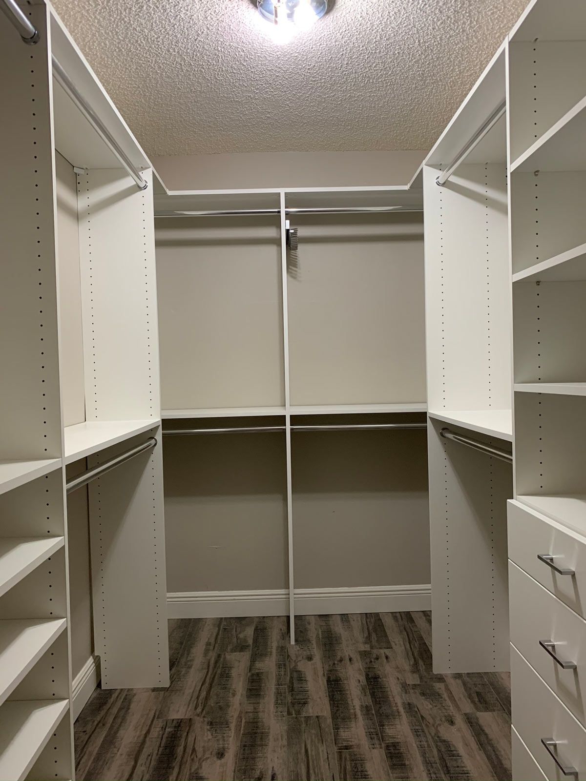 White Custom Closet System with Chrome Hardware & Hooks