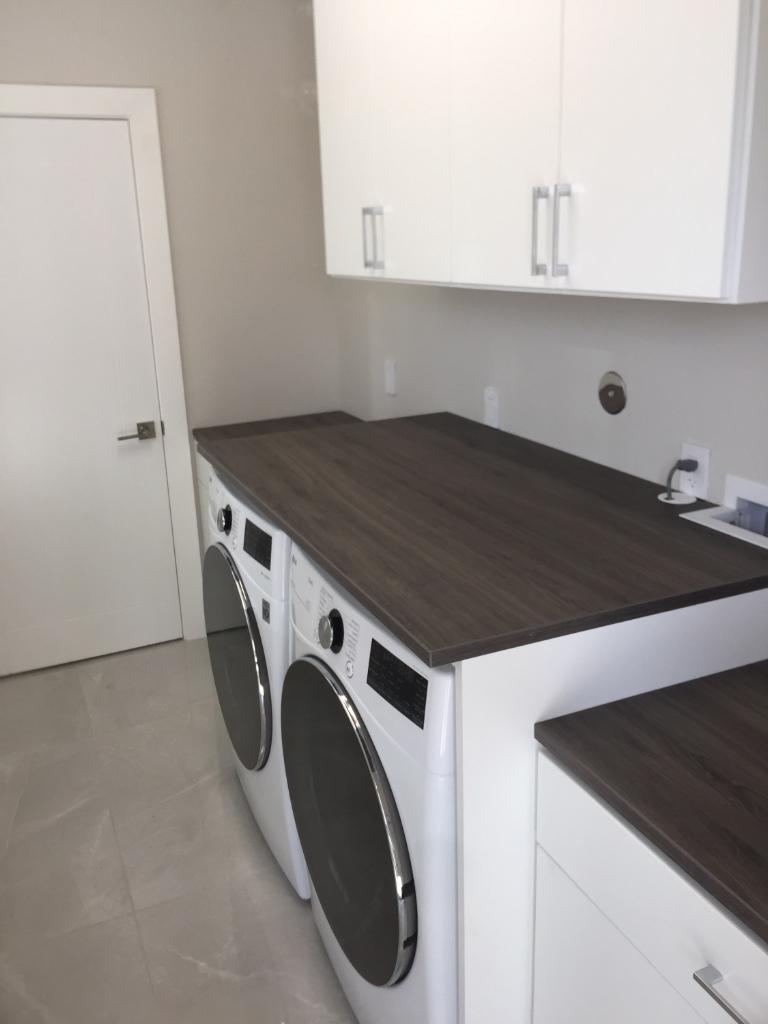 White Laundry System With Ash Countertops