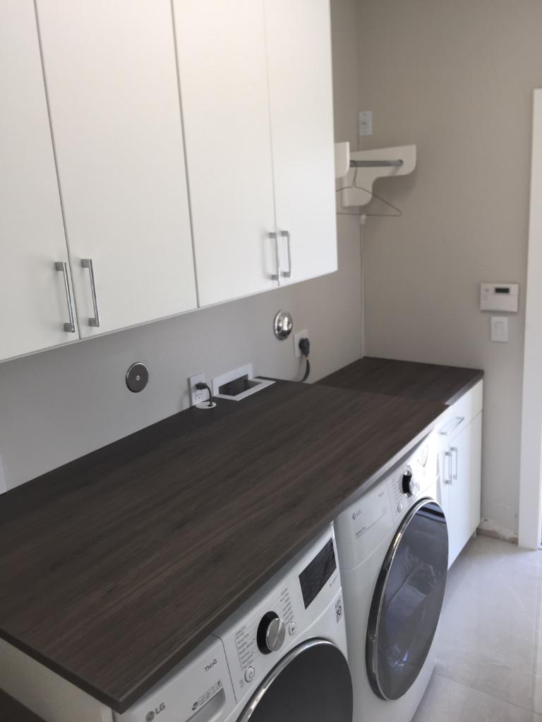 White Laundry System With Ash Countertops