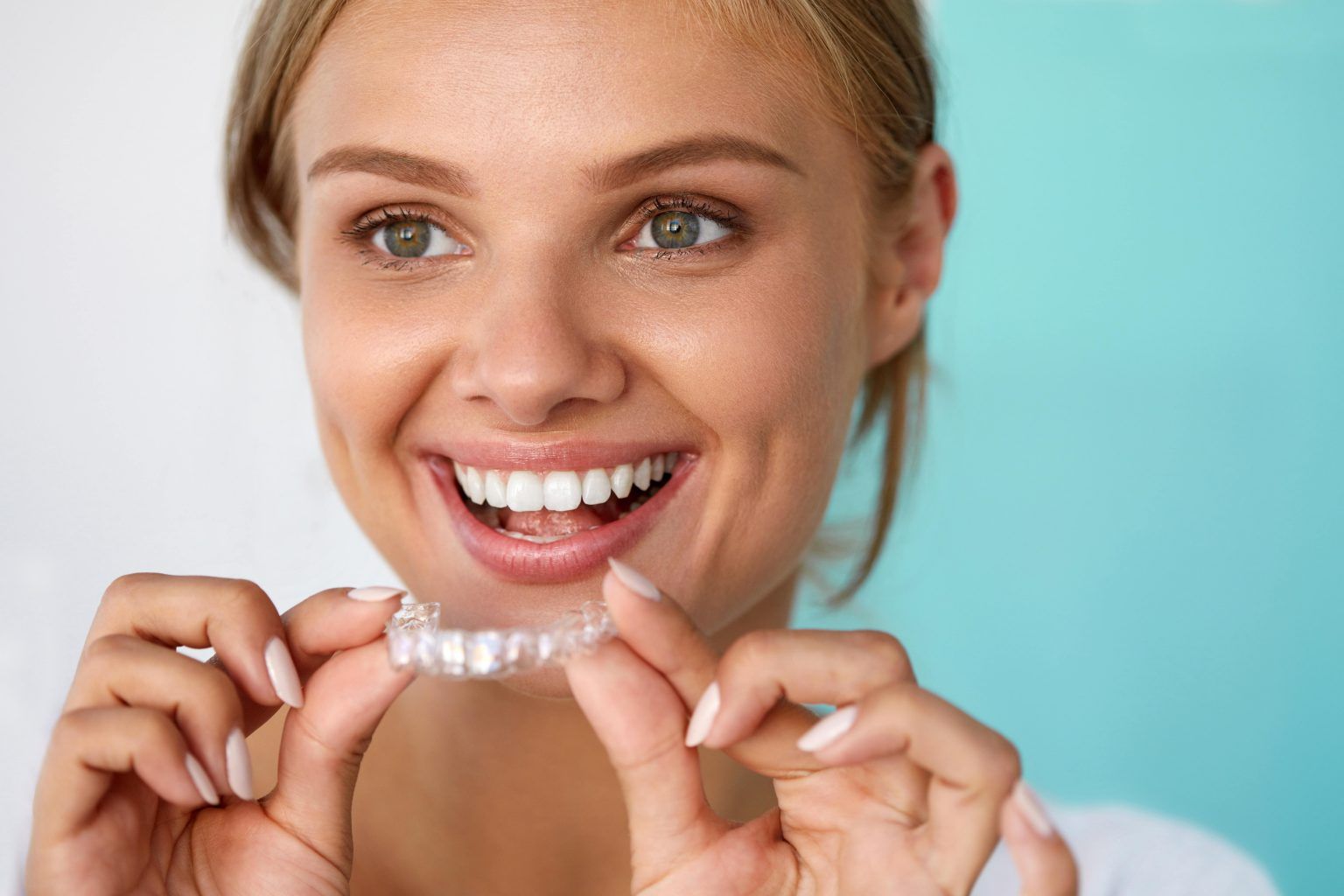 woman with invisalign | Invisalign in Monroe Township, NJ to repair and reshape teeth.