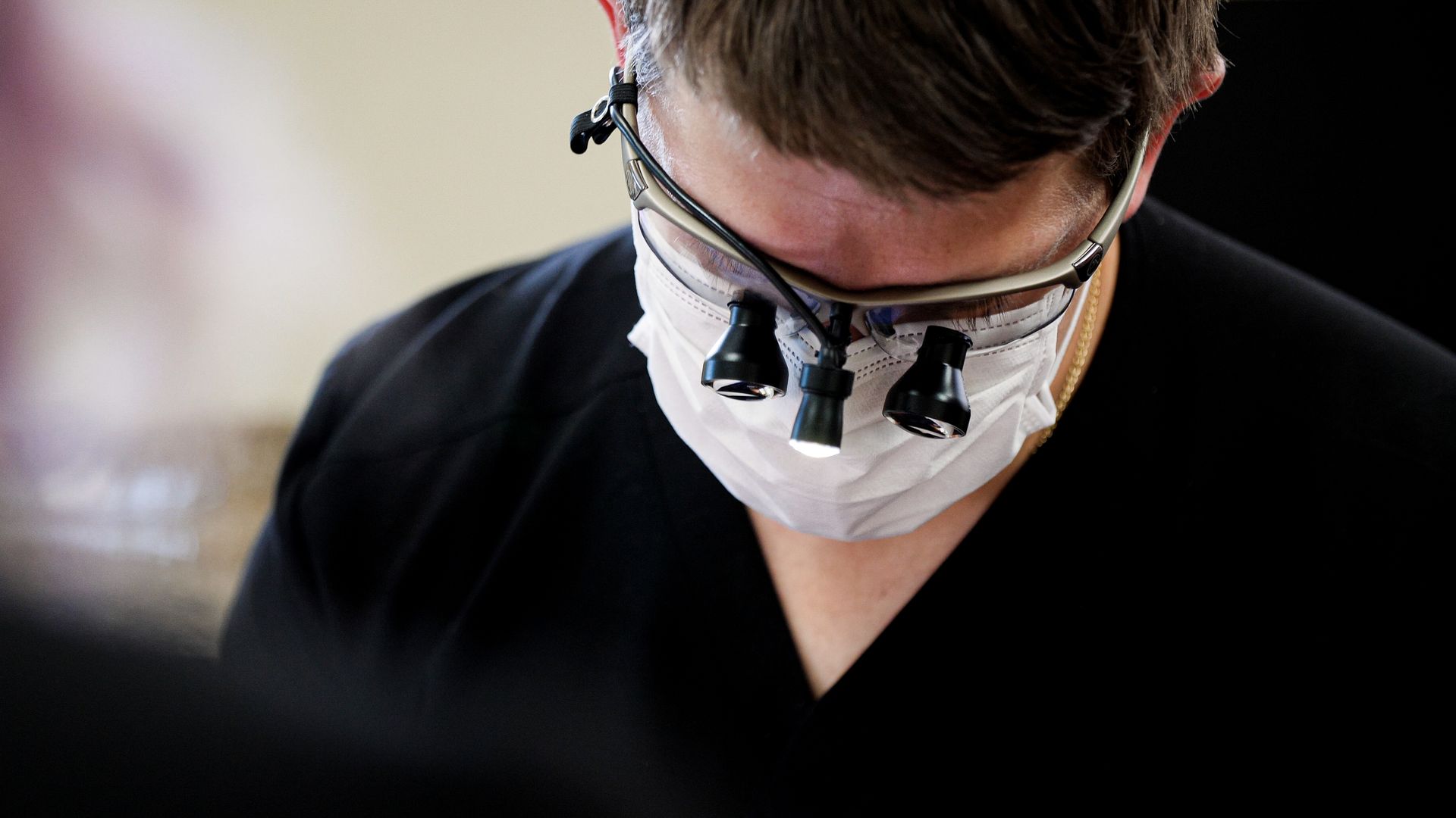 A dentist doing examination | Professional teeth cleaning in Monroe Township, NJ by our family dentist.