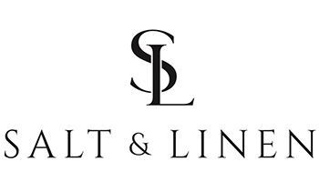 Logo for Salt & Linen featuring an interlocking black S and L monogram above the brand name in a serif font.