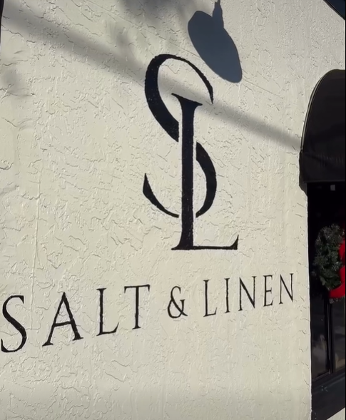 A black logo with the letters 