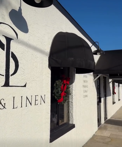 A white storefront with the text 