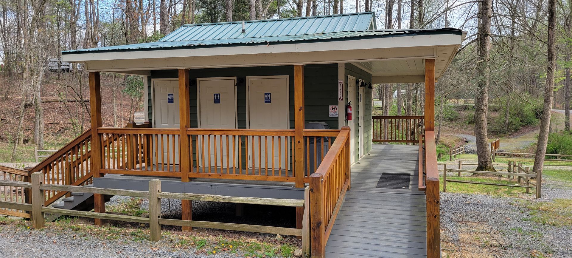 Restrooms and showers are in the dedicated tent campground with a ramp leading to them.