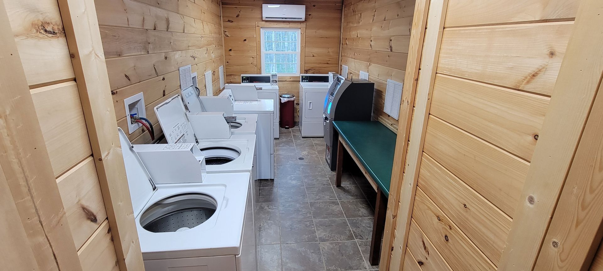 A laundromat with a lot of washers and dryers