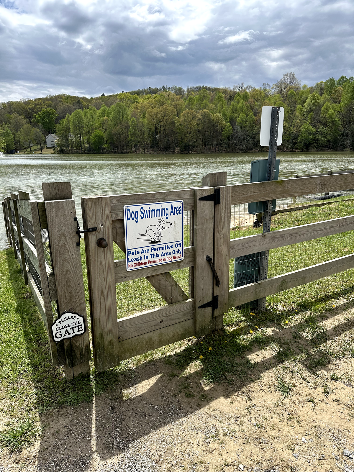 A wooden fence with a sign on it that says 