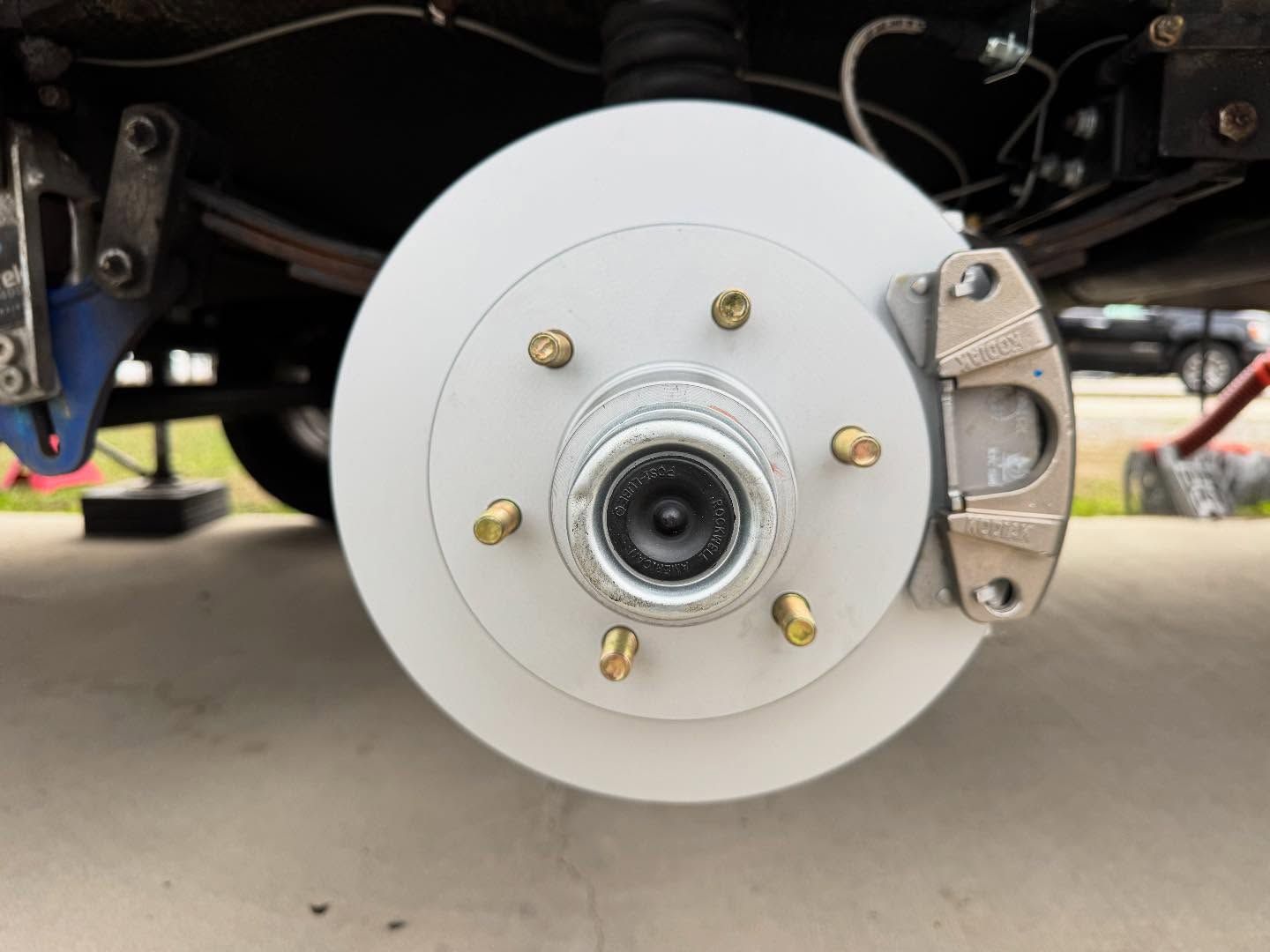 A close up of a brake disc on a car