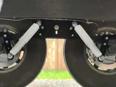 A close up of the rear suspension of a vehicle.