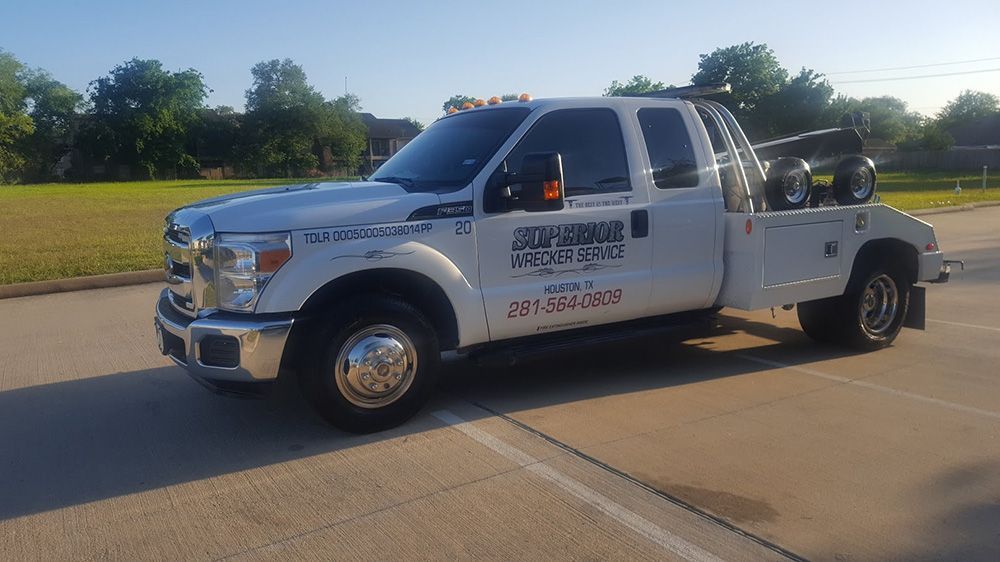 White tow truck on pavement
